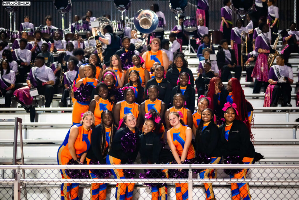 color guard group photo on football stadium stands 